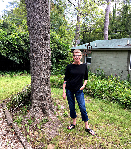 Debbie McDaniel stands under tree
